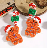 CHRISTMAS Beaded Gingerbread Boy Dangling from a Candy Cane Earrings